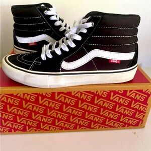 Black and white high top vans, men size 9.5 used in good conditions